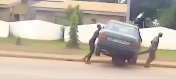 2 Men Spotted Towing Car On Cart Truck (Photos)